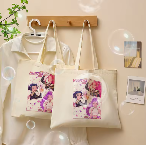 Kpop Demon Hunters canvas tote bag, large shoulder bag with vintage-inspired design, durable cotton canvas, fashion accessory for fans of the Huntr/x girl band.