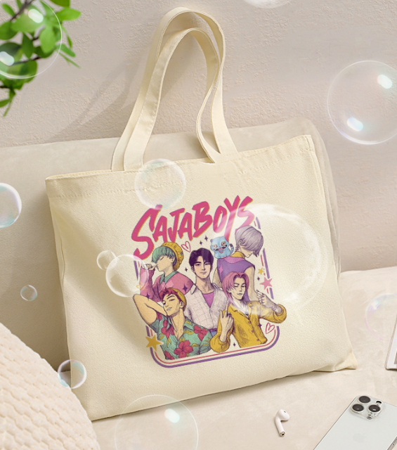 Kpop Demon Hunters canvas tote bag displayed on chair, large shoulder bag with vintage-inspired design, durable cotton canvas, stylish and functional for everyday use.