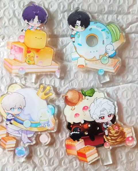 Love and Deepspace 2025 Dessert Party acrylic stands featuring Xavier, Zayne, Rafayel, and Sylus in colourful cartoon dessert designs.