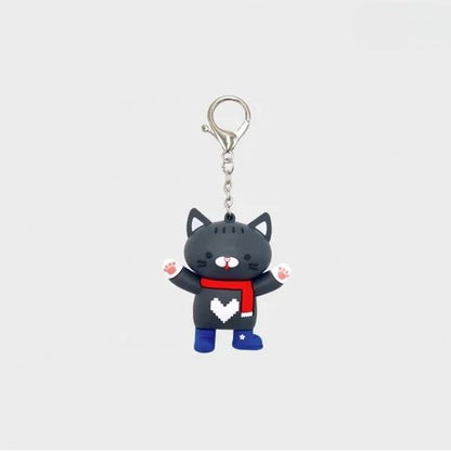 Front view of the Boys in Love Kaiju black cat keychain.