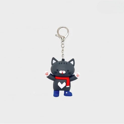 Front view of the Boys in Love Kaiju black cat keychain.