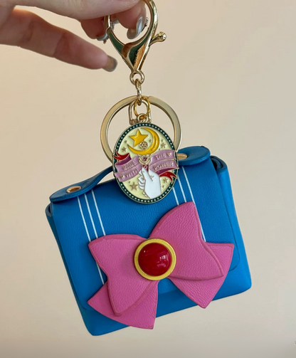 Cute Sailor Moon leather iPod/headphone bag and coin purse keychain in PU leather with heart pattern, shown in light blue, dark blue, and red versions, including inside, bottom, opened, and back views.