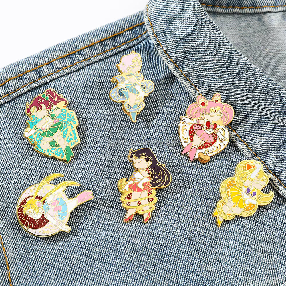 Set of six Sailor Moon–inspired enamel pins made of zinc alloy with soft enamel finish, including designs resembling Sailor Mars, Sailor Venus, Sailor Jupiter, Sailor Chibi Moon, Sailor Moon, and Sailor Uranus.