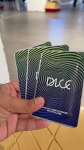 Person holding multiple DICE Year One Official Photocard Packs, each containing 3 random photocards featuring members, perfect for collecting, trading, or gifting to fans.