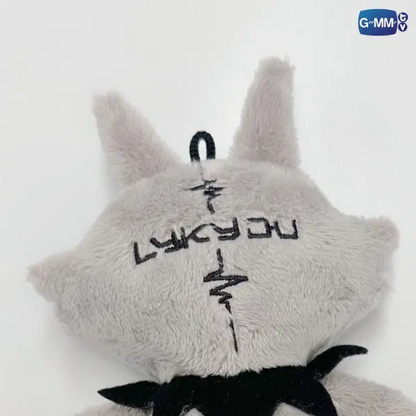 Close-up of the back of the LYKYOU plush keychain, highlighting the wolf ears, grey plush fabric, and reinforced stitching.