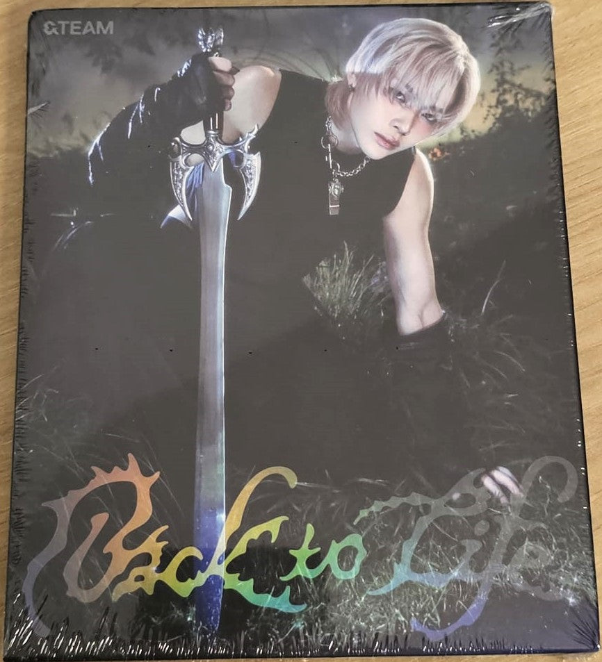 &TEAM Back to Life – ROAR ver. album cover featuring Nicholas, showcasing his individual concept photo in the dramatic “ROAR” theme styling.