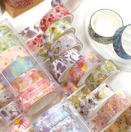 6-roll box of plant and flower print washi tapes displayed from a different angle, featuring assorted floral and botanical designs for crafting, journaling, and decorating.