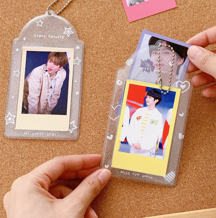 photocard being inserted into 3 inch glitter card sleeve transparent PVC holder official photocard protector star and heart design K pop card sleeve usage preview